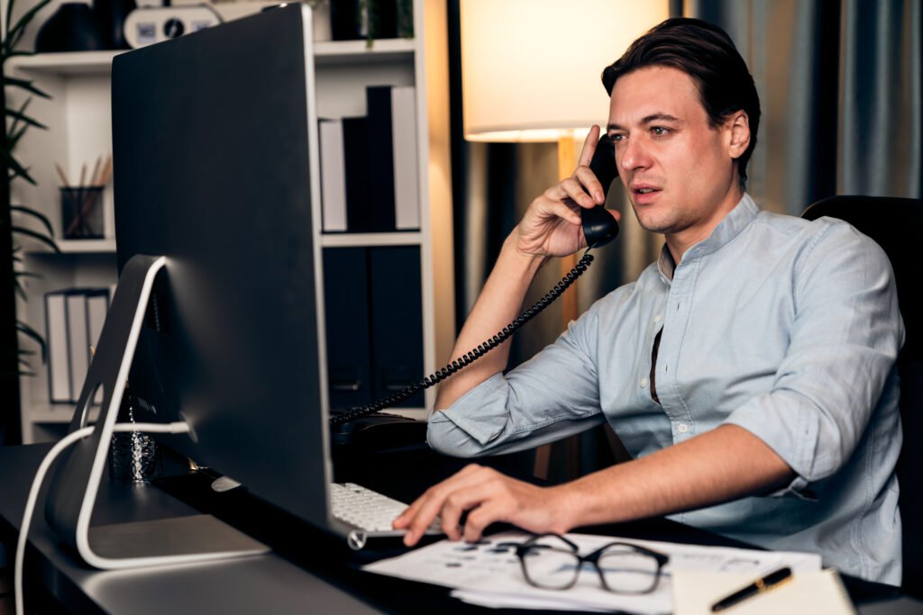 Businessman calling with telephone office consulting business data. Pecuniary.