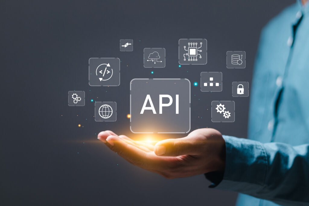 API Application Programming Interface concept, Man holding virtual screen of API icon Software development tool.