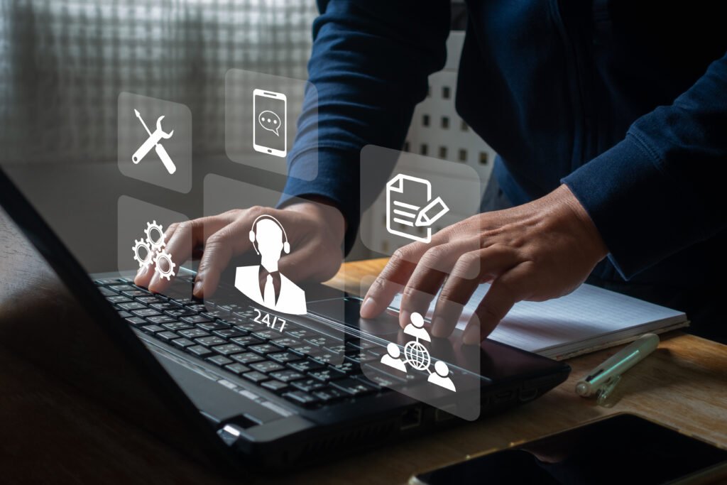 Technical support customer service concept. Businessman using laptop with vitual screen support customer assistance icon, Technology internet online, IT support, call center client service help tech.